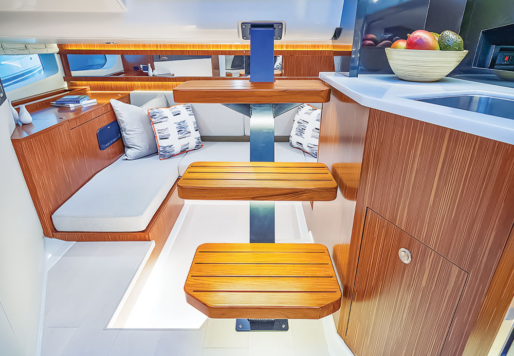 Sea Ran Sundancer 370 Outboard boat on open water interior kitchen