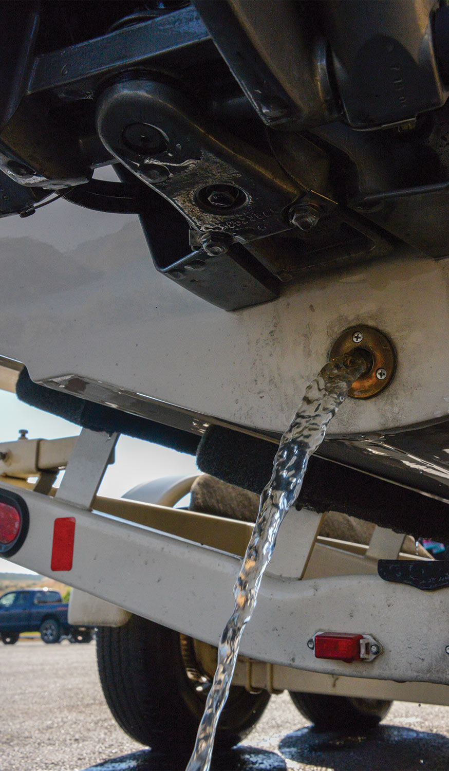 close view of the boat drain releasing water