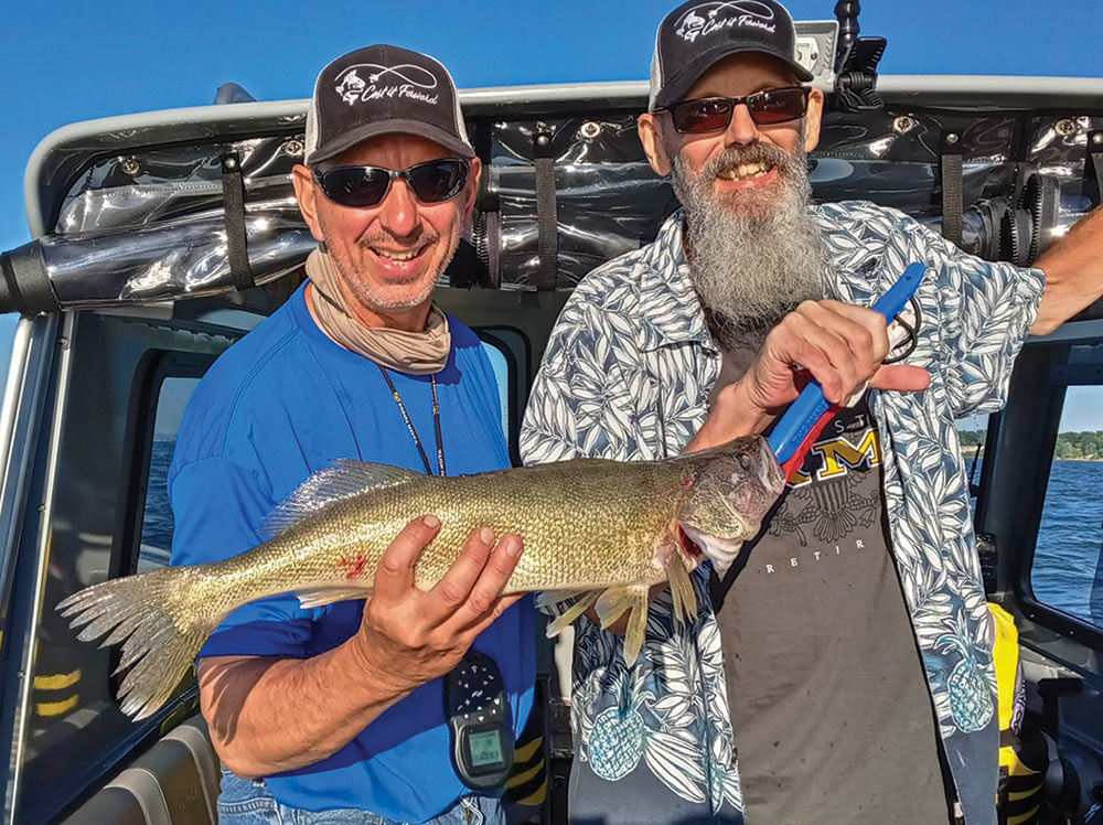 Great Lakes walleyes can be pushovers for properly presented trolled crankbaits this time of year, as veteran Bill Holk (right) learned while fishing with Art Panfil.