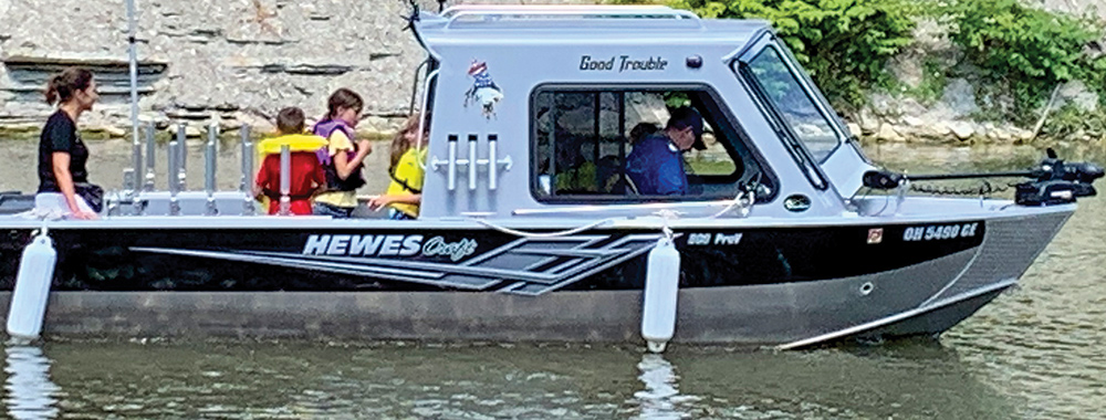 Art Panfil’s Hewescraft with a crew of happy kids headed out for a day of fishing on Lake Erie