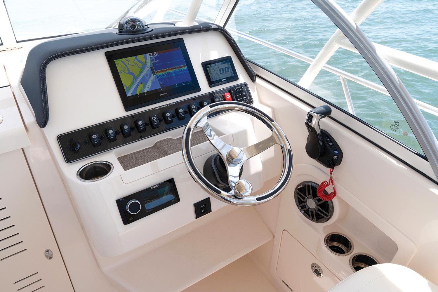 the steering wheel and dashboard of a Grady-White boat